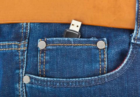 USB flash memory in jeans pocket Stock Photos