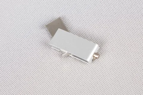 USB flash memory stick key with a silver lid on white background Stock Photos