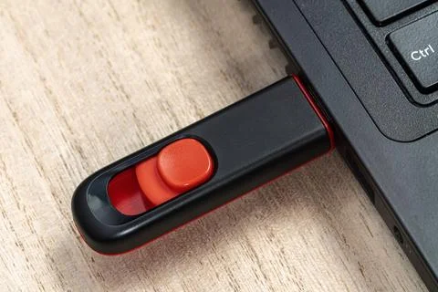 USB flash stick inserted to laptop Fotos de archivo