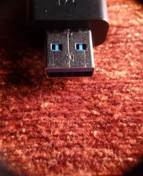 Usb flash stick on red background texture Stock Photos