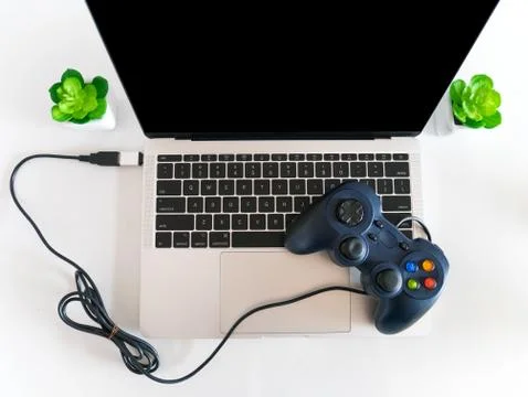 USB Gamepad Controller Attached to a Laptop Stock Photos