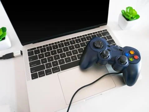 USB Gamepad Controller Attached to a Laptop Stock Photos