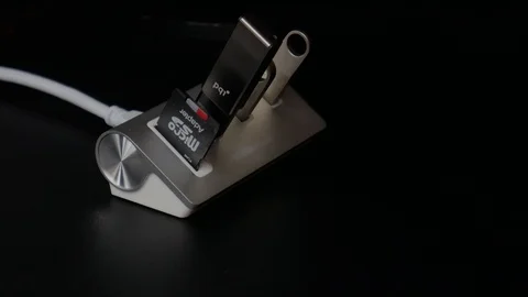 USB Hub with Flash Drives and SD Card plugged in Video stock 89636505