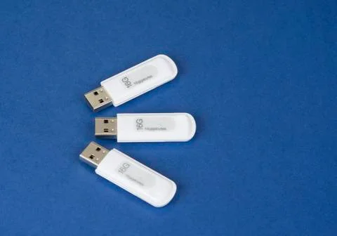 USB keys to save data on the bue background Stock Photos