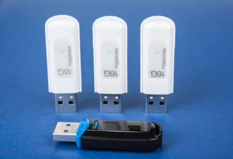 USB keys to save data on the bue background Stock Photos