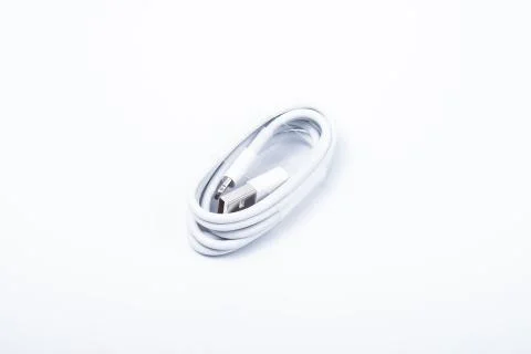 USB lightning cable for a smartphone on white background. Stock Photos