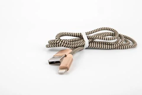 USB to Lightning cable on a white background. Phone accessory, charger and data Stock Photos