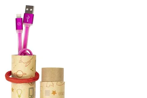 Usb lightning pink data cable in a cardboard tube close-up on white isolated, Stock Photos