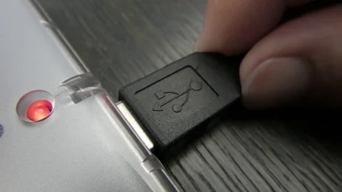 A USB plug gets connceted to hub Video stock 73928926