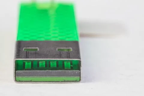 USB plug jack on small green storage pen flash drive. Stock Photos