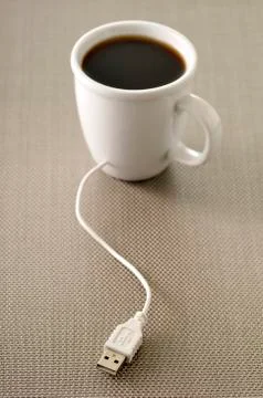 USB Plugged into Coffee Cup Stock Photos