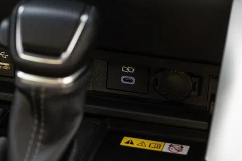 USB port in the car panel close up. Car interior detail. Car usb charger deta Foto stock