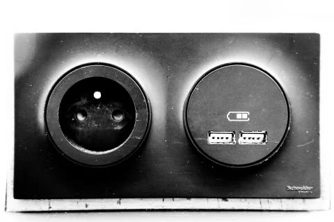 USB ports electronic plug on table in station Stock Photos