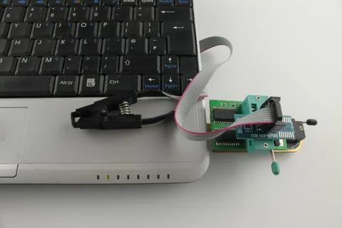 Usb programmer connected to a laptop close up Stock Photos