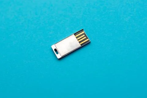 USB silver Flash Drive isolated on blue background close up Фото