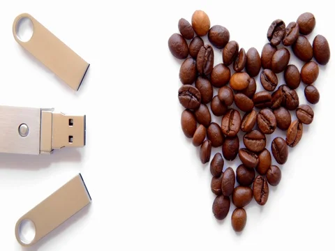 USB stick and heart from coffee beans on white background Stock Footage 73854580
