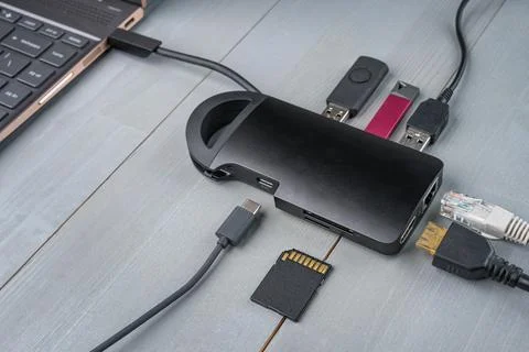 USB Type C adapter or hub connected to the laptop. Stock Photos