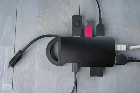 USB Type C adapter or hub with various accessories connected. Stock Photos
