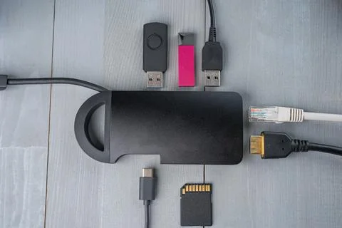 USB Type C adapter or hub with various accessories. Stock Photos