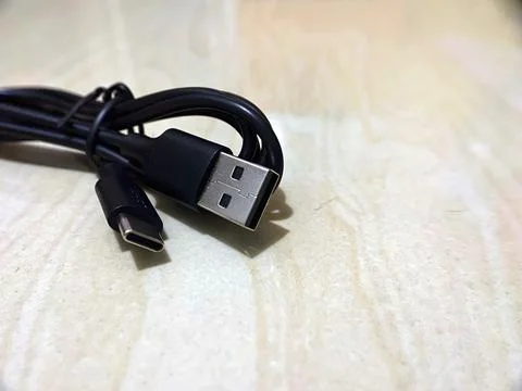 USB Type C and USB Type A Connectors on Wood Surface Stock Photos