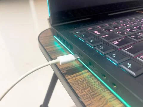 USB Type C Cable Connecting to Laptop Port Close Up Stock Photos