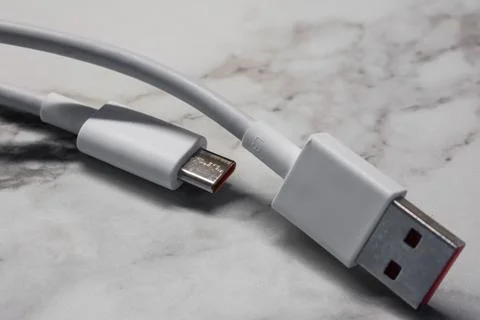 USB Type-C cable for devices with support fast charging on a light background Stock Photos