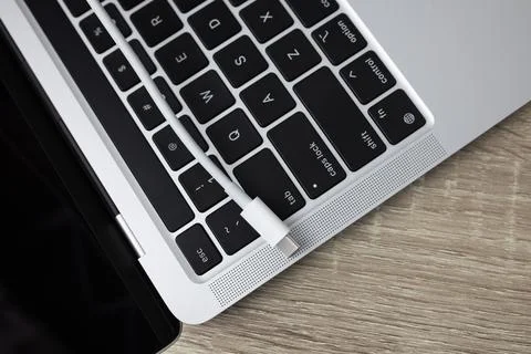 USB Type-C cable with laptop USB C ports close up. Top view Foto stock