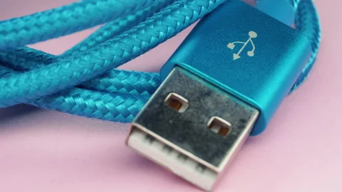 Usb type c cable panning on pink backround. Stock Footage 155285359