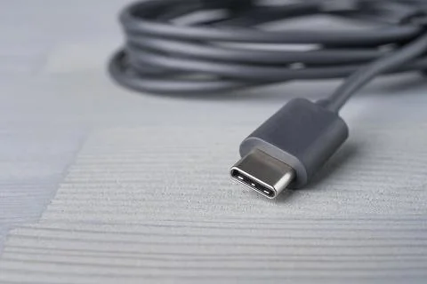 USB Type C connector with a grey cable. Stock Photos