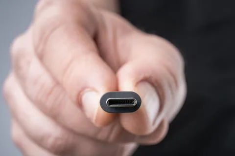 USB Type C connector with a grey cable. Photos