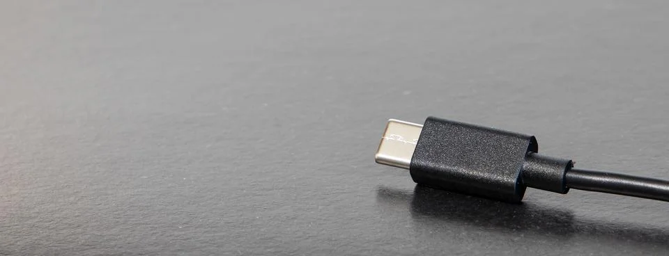 USB type-c jack cable for mobile phone on table common device tool object on  Stock Photos