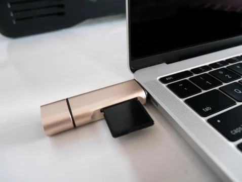 USB Type-C Memory Card Reader Attached to USB Type-C Port Laptop Stock Photos