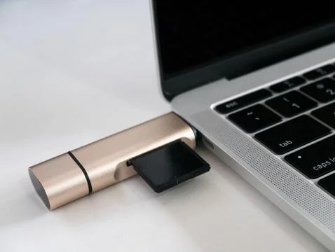 USB Type-C Memory Card Reader Attached to USB Type-C Port Laptop Stock Photos