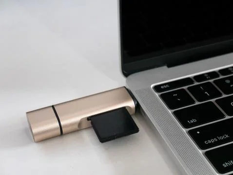USB Type-C Memory Card Reader Attached to USB Type-C Port Laptop Stock Photos