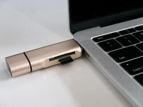 USB Type-C Memory Card Reader Attached to USB Type-C Port Laptop Stock Photos