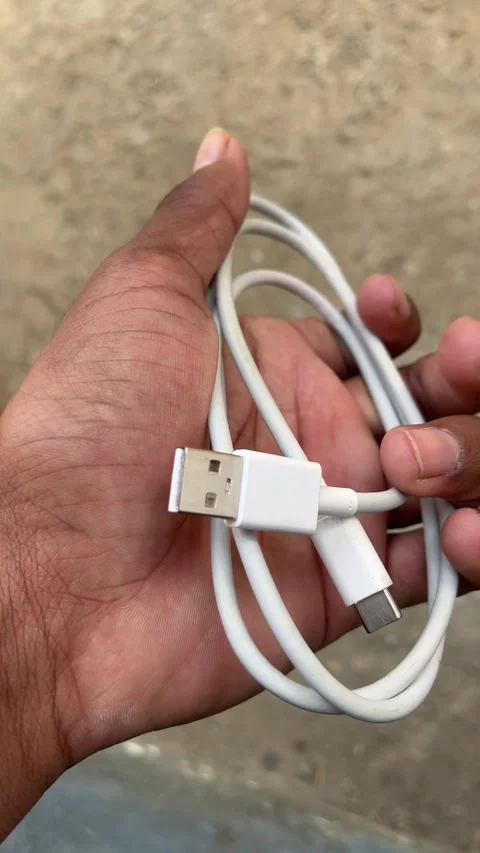 USB to Type-C White Cable Held in Hand – Close-Up 4K Video Stock Footage 321945066