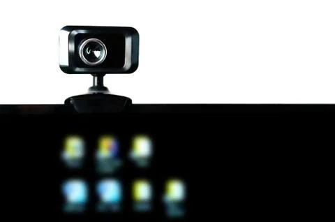 USB Webcam, Web Camera, Mounted on Computer Monitor with Blurred Icons on Bla Stock Photos