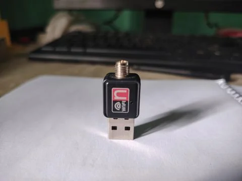 USB WiFi adapter device for wireless internet connection on a white paper Fotos Stock