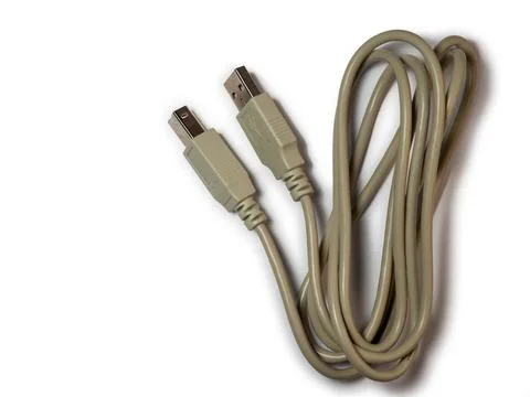 Usb wire. Accessories for technology. Charging cable. A coil of wire. Stock Photos