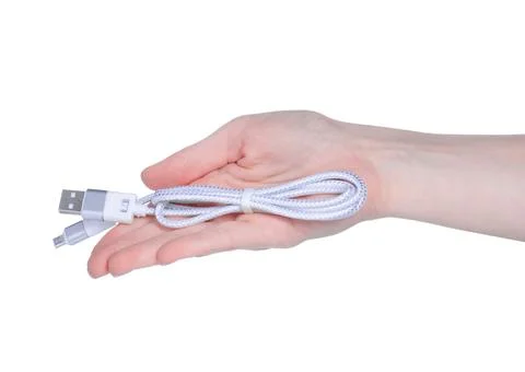 USB wire charger cable in hand Stock Photos