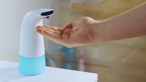 .Use automatic foam dispenser. hand disinfection Stock Footage 128844343