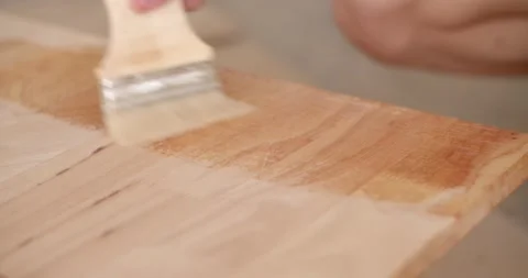 Use a brush to apply lacquer to the wood the first time after smoothing. After a Stock Footage 222620706