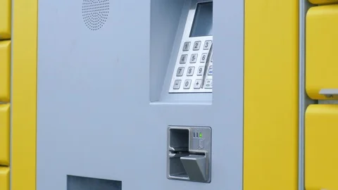 Use the card reader and type in the TAN number on a parcel station Video stock 97406424