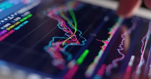 Use of digital tablet computer with stock market graph Stock Footage