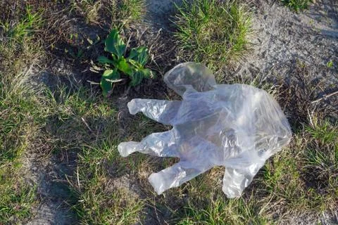 Use of disposable or Discarded plastic gloves during the coronavirus pandemic Stock Photos