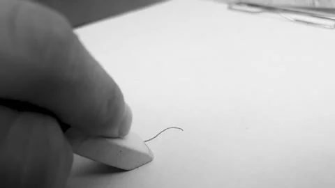 Use of an eraser. Use the eraser to erase pencil lettering Stock Footage 302377239