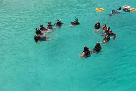 Use a floating kit to float on the sea front Stock Photos