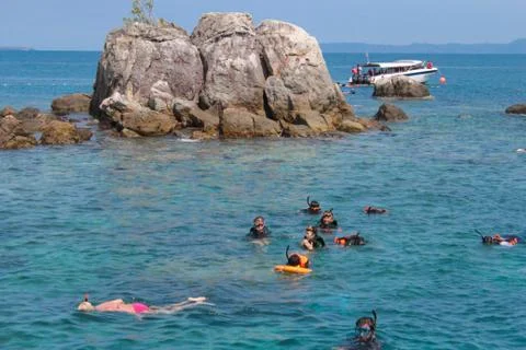Use a floating kit to float on the sea front Stock Photos
