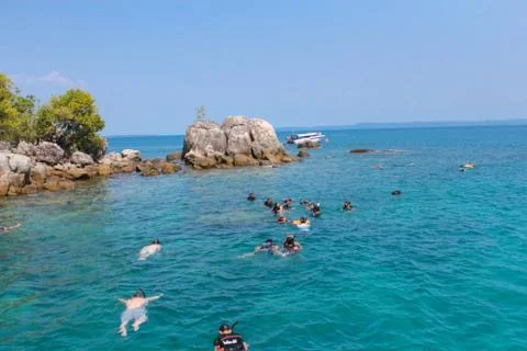 Use a floating kit to float on the sea front Stock Photos