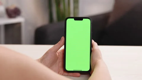 Use green screen for copy space closeup. Chroma key mock-up on smartphone in Stock Footage 194810564